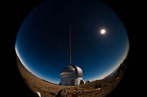Capture of the Gemini South telescope on the night of January 21-22, 2011 during the first propagation of the GeMS laser guide star system on the sky.