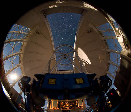 Nighttime image of the Gemini South telescope. The Near-Infrared Coronagraphic Imager (NICI) is illuminated at the bottom of the telescope.