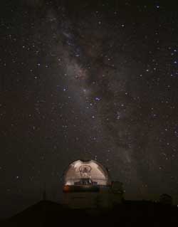 Photo of the Gemini North telescope with the Milky Way visible in the sky.