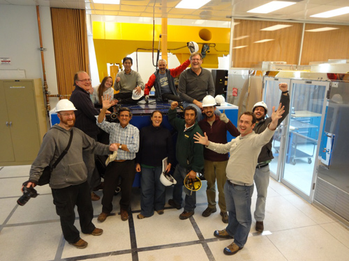 Photo of the GPI team celebrating the arrival and assembly of the instrument's systems at the Gemini South instrument lab.