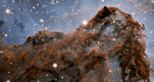 This image shows a 50-trillion-km long section of the western wall in the Carina Nebula, as observed with adaptive optics on the Gemini South telescope.